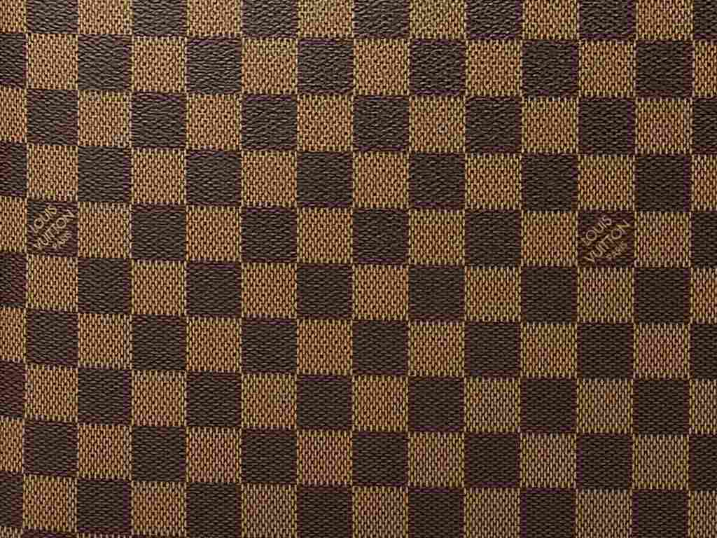 Monograma Damier Ébène Louis Vuitton. Clique na imagem e confira peças da marca!