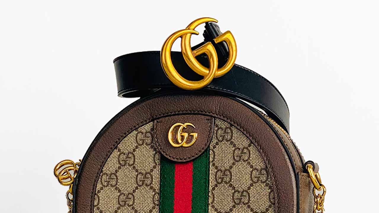 Bolsa e Cinto Gucci.