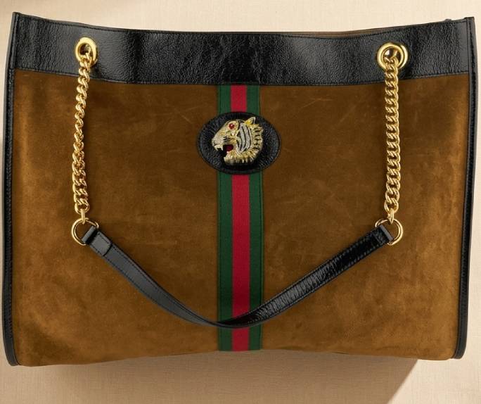 Detalhes dos materiais das bolsas gucci: a camurça e suede do modelo ophidia.